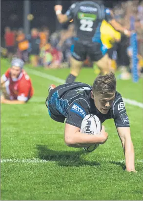  ??  ?? FINISHING TOUCH: Josh Henderson dives over for one of two late Glasgow scores. Picture: SNS