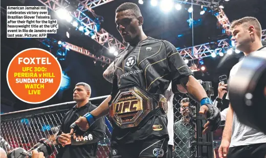  ?? ?? American Jamahal Hill celebrates victory over Brazilian Glover Teixeira after their fight for the light heavyweigh­t title at the UFC event in Rio de Janeiro early last year. Picture: AFP