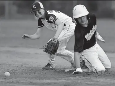  ?? SARAH GORDON/THE DAY ?? Montville’s Desmond Powers slides safely into second base as East Lyme’s Ryan Cellemme waits for the ball during Tuesday night’s District 10 Little League baseball final at East Lyme. Montville won the title with a 3-1 victory.