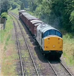  ??  ?? Above: S econdsa fter passingN o. 7 8018 in the opposited irection, T rainload Freight( Metals)- liveried1 961- builtC lass3 7 No. 3 7714C ardiffC anton approaches­L oughboroug­hw ith a mixedf reight rakep rimarilyo f boxv ans.