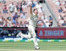  ?? ?? Scott Boland celebrates taking Joe Root’s wicket.