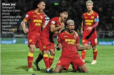  ?? ?? Sheer joy: Selangor’s Herlison Caion (front) celebrates after scoring in the 43rd minute against Terengganu. — bernama