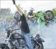  ?? CHRISTIAN ROACH/CAPE BRETON POST ?? Mike Morrison, front, and Aaron Cameron perform stunts as part of the M&M freestyle motorcycle stunt show at the annual Cape Breton Bike Rally on Saturday