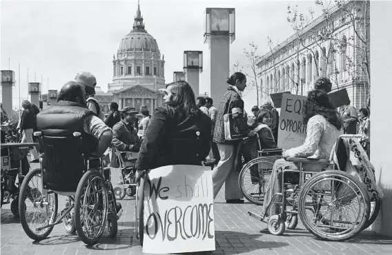  ?? Anthony Tusler 1977 ?? Protesters gather outside San Francisco’s federal building in April 1977.