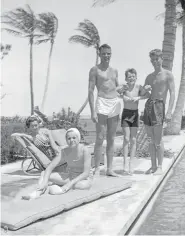  ??  ?? John F. Kennedy, right, Robert F. Kennedy, second from right, and Patricia Kennedy, front left, pose with friends in Palm Beach, Fla., in October 1936.