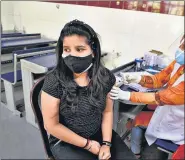  ?? ARVIND YADAV/HT PHOTO ?? A health worker administer­s a dose of Covaxin, at Govt Sarvodaya Bal Vidyalaya in New Delhi on Thursday.