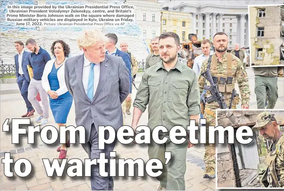  ?? ?? In this image provided by the Ukrainian Presidenti­al Press Office, Ukrainian President Volodymyr Zelenskyy, centre, and Britain’s Prime Minister Boris Johnson walk on the square where damaged Russian military vehicles are displayed in Kyiv, Ukraine on Friday, June 17, 2022. Picture: Ukrainian Presidenti­al Press Office via AP