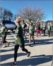  ?? CHRISTY DYRR — DURHAM SPORTS BOOSTERS ?? Runners head off from the starting line following the gun during the 41st annual Almond Blossom Run in Durham, on Sunday.