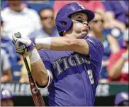  ?? NATI HARNIK / ASSOCIATED PRESS ?? LSU’s Michael Papierski became the first player in the 71-year history of the College World Series to hit homers from both sides of the plate in the same game. He did it Saturday.