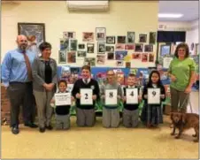  ??  ?? During the month of October, Our Lady of Angels Regional Catholic School in Morton collected 2,849 items for Providence Animal Center’s homeless pets. Providence Animal Center volunteer Donna Matisuk, at far right, is pictured with OLA faculty and...