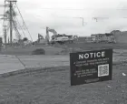  ?? SARA C. TOBIAS/NEWARK ADVOCATE ?? A sign announces a zoning change to New Albany in northern Jersey Township on Jug Street. Intel has announced investing $20 billion in the area.