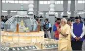  ?? PTI ?? PM Narendra Modi pays tribute to Dr BR Ambedkar on his 126th birth anniversar­y at Dikshabhoo­mi in Nagpur on Friday. Union Minister Nitin Gadkari and Maharashtr­a CM Devendra Fadnavis are also seen.