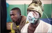  ?? Pictures: ALEXIS HUGUET/MSF ?? ATTACKED: Jope Koromadji, 52, a blacksmith, is treated at the Paoua hospital, north-western Central African Republic, after being stabbed by armed men in Betoko, 45km north of Paoua.