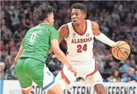  ?? MARVIN GENTRY/USA TODAY SPORTS ?? Alabama forward Brandon Miller, right, is defended on Thursday by Texas A&M-Corpus Christi guard Trevian Tennyson.