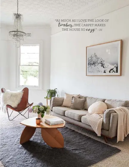  ??  ?? LIVING AREA Gracefully designed around the eye-catching ‘Leaning Leaf’ Tasmanian eucalypt table, made by local artisan Duncan Meerding, a timber-framed Middle Of Nowhere ‘Alps’ print and a butterfly chair by Cuero Design add a layer of warmth to the...