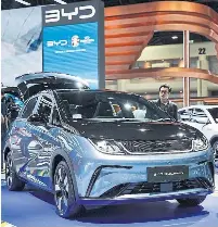  ?? NURPHOTO VIA GETTY IMAGES ?? Many Canadians wonder why we should keep a 100 per cent tariff on affordable Chinese EVs, like this BYD Dolphin. A survey found fourinfive Canadians would prefer a lower tariff or no tariff at all, write Joanna Kyriazis and Trevor Melanson.