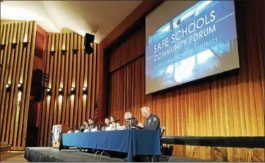  ?? DAN SOKIL - DIGITAL FIRST MEDIA ?? North Penn School District officials speak to the public during a Safe Schools Community Forum on Thursday. From left to right are District Coordinato­r of Emergency Management Chris Doerr, school board members Jonathan Kassa and Christian Fusco,...