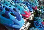  ?? LAUREN HALLIGAN - MEDIANEWS GROUP ?? Children’s bike helmets are given out to local youth each summer as part of the Safe Summer Bike Helmet Safety Program.