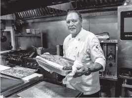  ?? PEDRO PORTAL pportal@miamiheral­d.com ?? Cook Noraldo Saavedra works at MKT Kitchen in Coral Gables after deciding not to go back to his previous job at the Fontainebl­eau.