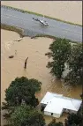  ?? Arkansas Democrat- Gazette/ BENJAMIN KRAIN ?? Floodwater­s receded Thursday from U. S. 412 in the Portia area of Lawrence County, but the highway remained closed.