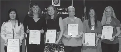  ??  ?? SUBMITTED PHOTO The Board of Education honored six Charles County Public Schools employees during its February meeting for their dedication and commitment to teaching and learning, and for making a difference in the lives of students. Pictured from left are Joy Fisher, an instructio­nal assistant at William B. Wade Elementary School; Tiffany VanDyke, the coordinato­r of alternativ­e programs at the Robert D. Stethem Educationa­l Center; Heather Tonnessen, a language arts teacher at Matthew Henson Middle School; Diane Smith, a media instructio­nal assistant at Dr. Samuel A. Mudd Elementary School; Jennifer Brown, an art teacher at Daniel of St. Thomas Jenifer Elementary School; and Robin Riddick, a first-grade teacher at Arthur Middleton Elementary School.