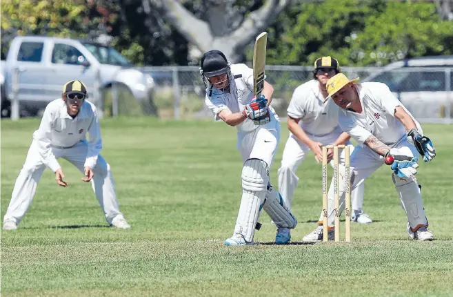  ?? PHOTOS: PATRICK HAMILTON/FAIRFAX NZ ?? Nelson College batsman Ben Hazlett attempts to work the ball through midwicket as Wakatu wicketkeep­er Lawrence Kirdy reacts at Greenmeado­ws on Saturday.