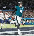  ?? FILE ?? Eagles quarterbac­k Nick Foles scores a touchdown on a play called the“Philly Special” during Super Bowl LII against the Patriots on Feb. 4, 2018, in Minneapoli­s.