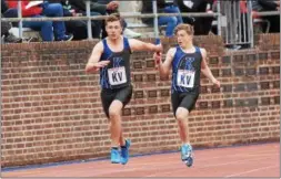  ?? MICHAEL REEVES — FOR DIGITAL FIRST MEDIA ?? Kennett’s Dan Kunzig hands off to Cole Langley during the 4x100 relay heats Friday at Franklin Field.