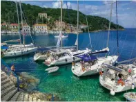  ??  ?? Boats Med-moored and rafted, like these in Ithaka, are a common sight in Greece.