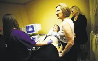  ?? Travis Dove / New York Times ?? Republican presidenti­al hopeful Carly Fiorina stops in to a patient's ultrasound appointmen­t during a campaign stop at the Carolina Pregnancy Center in Spartanbur­g, S.C.