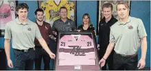  ?? JESSICA NYZNIK EXAMINER ?? Peterborou­gh Petes Zach Gallant, left, and Adam Timleck join Steve Larmer, former NHLer, Alison Payne, senior manager of Canadian Cancer Society Peterborou­gh and Durham community office, and Petes Chris Paquette and Austin Osmanski for a Pink in the Rink press conference at the agency’s office Wednesday. The fundraiser takes place Feb. 2.