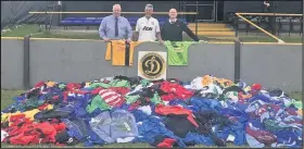  ??  ?? Pictured with some of the kit collected during the appeal are, from left to right: Ian Beech (CEO of Loughborou­gh Dynamo), Darren Rodgers (Chairman of Loughborou­gh Dynamo) and Stuart Busby (Commercial Director of Loughborou­gh Dynamo).