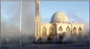  ??  ?? This image from amateur video made available by Shaam News Network on Thursday shows smoke filling the air near a mosque in Homs, Syria.