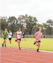  ?? ?? Evan Pass in the lead of the U15 boys 1500 metre race with Ben Hagley and Beau Asmussen hot on his heels.