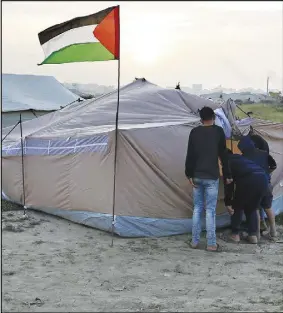  ?? AP PHOTO ?? Palestinia­ns are setting up tents in preparatio­n for mass demonstrat­ions along the Gaza strip border with Israel.