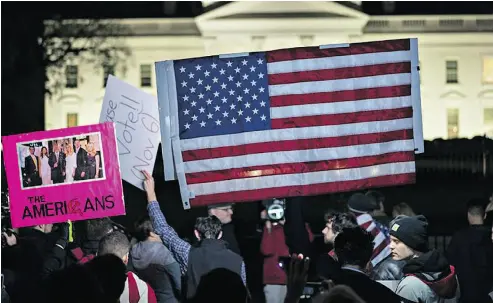  ?? ANDREW HARNIK / THE ASSOCIATED PRESS FILES ?? The ugly culture-war polarizati­on that has w the United States has not made too much of a mark in Canada, the National Post’s Terry Glavin writes.