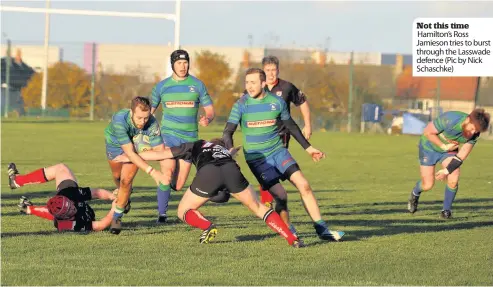  ??  ?? Not this time Hamilton’s Ross Jamieson tries to burst through the Lasswade defence (Pic by Nick Schaschke)