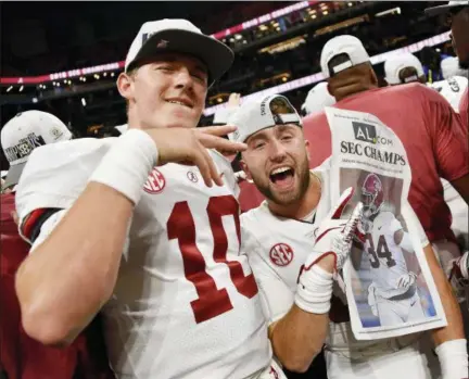  ?? JOHN AMIS — THE ASSOCIATED PRESS ?? Alabama players celebrate after the second half of the Southeaste­rn Conference championsh­ip game against Georgia, Saturday in Atlanta. Alabama won 35-28.