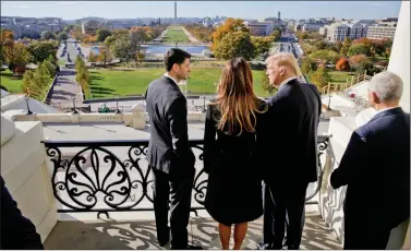  ?? REUTERS ?? (L-R) Speaker of the House Paul Ryan shows Melania Trump, US President-elect Donald Trump, and Vice-President Mike Pence the Mall from the Speaker’s Balcony on Capitol Hill in Washington, on Friday.