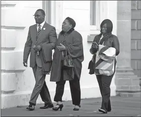  ?? AP/The Post And Courier/LEROY BURNELL ?? The Rev. Kylon Middleton (from left), Jennifer Pinckney, widow of Emanuel AME Church’s slain pastor, the Rev. Clementa Pinckney, and Johnette Martinez enter the courthouse in Charleston, S.C., on Wednesday for the sentencing phase of Dylann Roof’s trial.