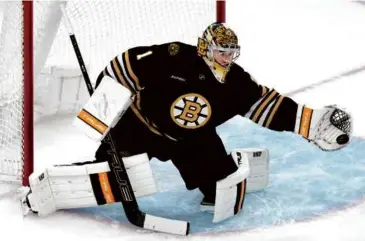  ?? CHARLES KRUPA/ASSOCIATED PRESS ?? While Joel Hofer made 36 saves in the Blues’ end, Jeremy Swayman stopped only 17 shots for the Bruins in the loss, allowing four goals over the first two periods.