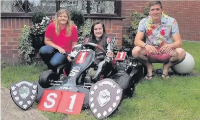  ??  ?? ●● Ciara Power (at the wheel) with mechanic Rebecca Newton and team leader Mark Bellerby