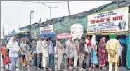  ?? ANI ?? Farmers stand in a queue outside a tent during protest in New Delhi on July 18.