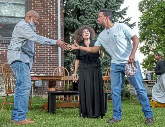  ?? Steph Chambers/ Steph Chambers/ Post- Gazette ?? From left, Kevin Brown as Solly Two Kings, Chrystal Bates as Aunt Ester and Jonathan Berry as Citizen Barlow rehearse Pittsburgh Playwright­s’ “Gem of the the Hill District home of artistic director Mark Clayton Southers. “Gem” will be performed at 1839 Wylie Ave., the address given by playwright August Wilson.