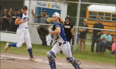  ?? Terrance Armstard/News-Times ?? Run down: Parkers Chapel catcher Bailey Norwood prepares to throw to third to get a Rison runner in a rundown. PC pitcher Courtney Phelps rushes to home plate to back up on the play.