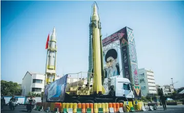  ?? (Nazanin Tabatabaee Yazdi/TIMA/Reuters) ?? A DISPLAY FEATURING missiles and a portrait of Iran’s Supreme Leader Ayatollah Ali Khamenei is seen at Baharestan Square in Tehran on September 27.