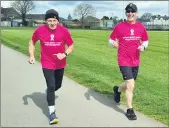  ??  ?? Maurice Tobin and Willie Cody pictured kicking off the 50km charity run at St Colman’s pitch.