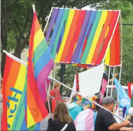  ?? Herald photos by Al Beeber ?? Inclement weather couldn’t dampen enthusiasm in downtown Lethbridge for the city’s annual Pride Parade Saturday. A strong turnout of participan­ts and supporters, above and below, took to the streets to celebrate the event.