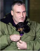  ??  ?? LEFT: Anton Tonshin, head of the FPI liquid breathing laboratory, holds Nicholas the dachshund.