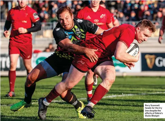  ??  ?? Rory Scannell heads for the try line despite the efforts of Zebre’s Giulio Bisegni